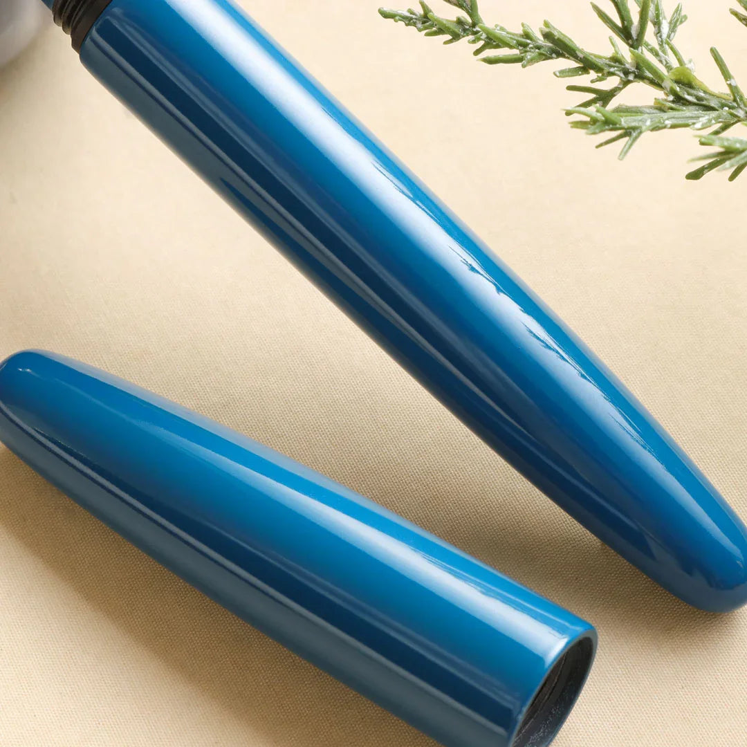 Close-up of the Aizu Urushi Ao fountain pen revealing the layered depth of its deep blue lacquer.