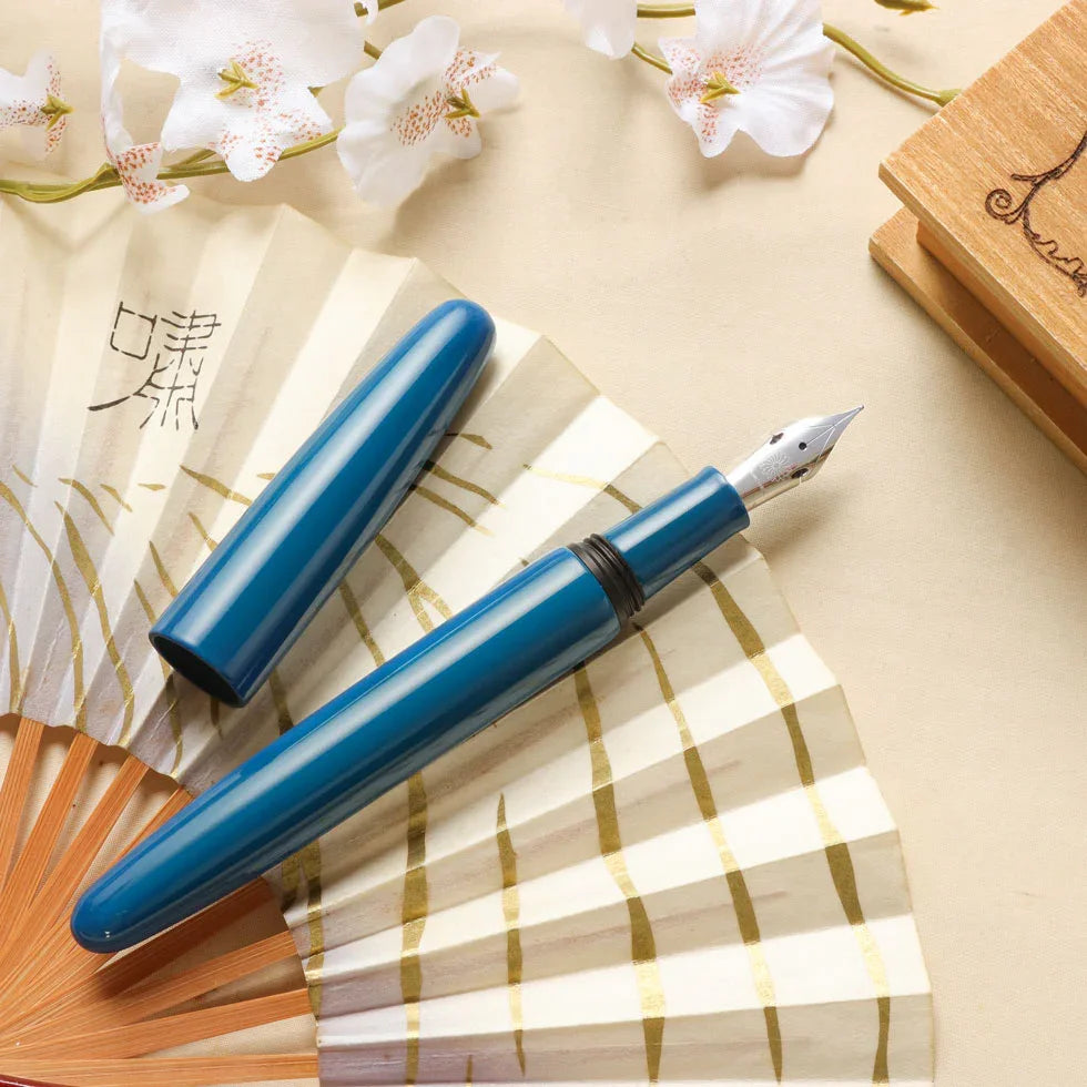 Aizu Urushi Ao fountain pen with a deep blue Urushi showing the soft flex steel nib