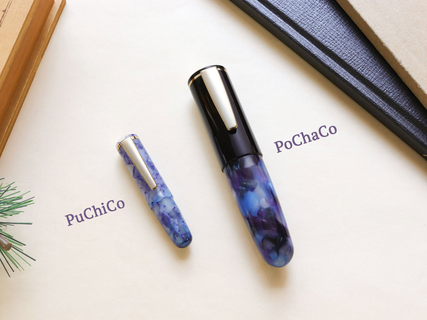Size comparison between Pochaco midnight violet with purple and black hue and mini version puchico fountain pen