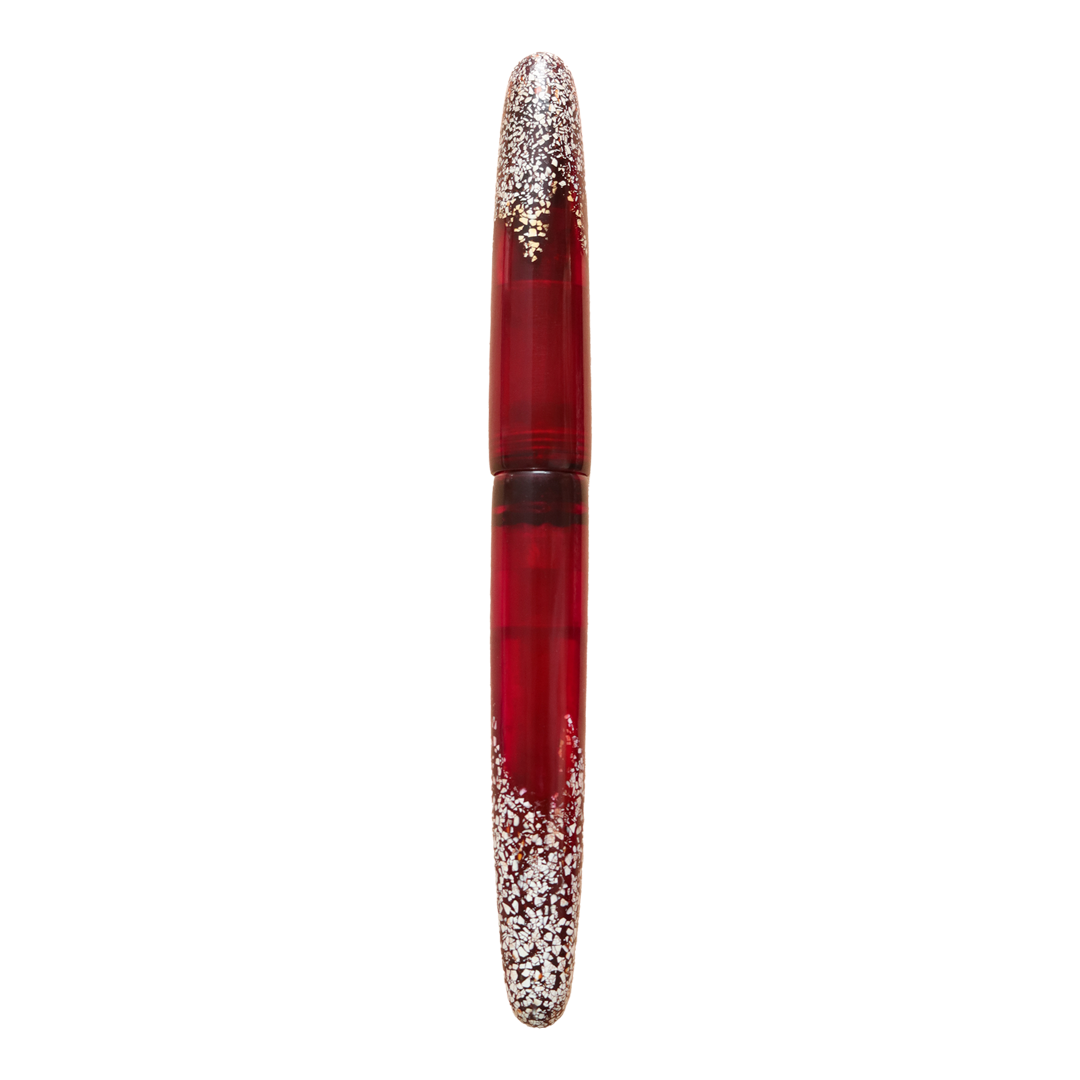 Premium handcrafted Vietnamese lacquer fountain pen with a bold ruby red finish, Son Mai technique, and delicate eggshell inlay symbolizing the beauty of imperfect rubies